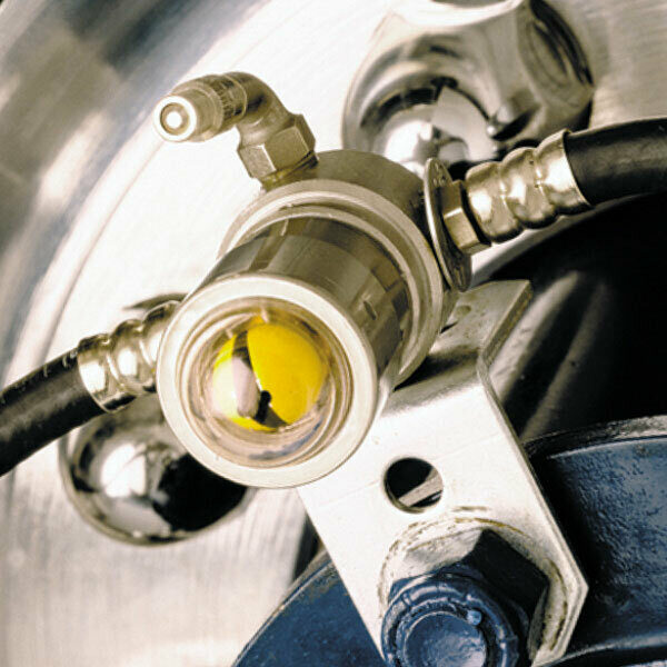 A Cat's Eye unit on a tire featuring the single fill point