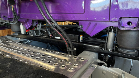 A ROI Cabmate installed on a purple Volvo semi truck.