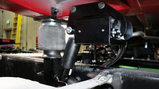 A ROI Cabmate installed on a red Navistar truck.