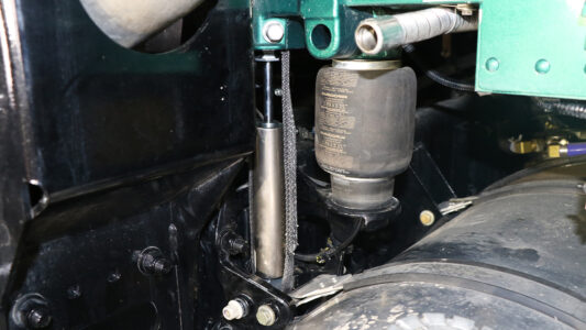 A ROI Cabmate installed on a green Kenworth semi-truck.