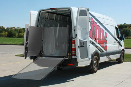 A demonstrative image of the Link swivel ramp, displaying its ability to swivel inside and outside the vehicle, as well as in its upright and deployed positions