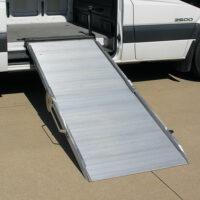 A mounted ramp extended and deployed out of the side of a cargo van