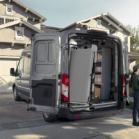 A Link Swivel ramp swiveled 90 degrees outside a Ford Transit Delivery Van.