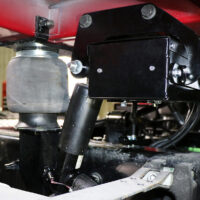 A ROI Cabmate installed on a red Navistar truck.