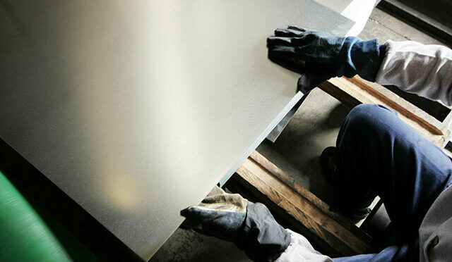 Hands on a piece of sheet metal