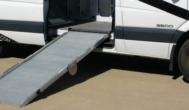 Link Mfg. aluminum ramp extended out of the side door of a cargo vehicle